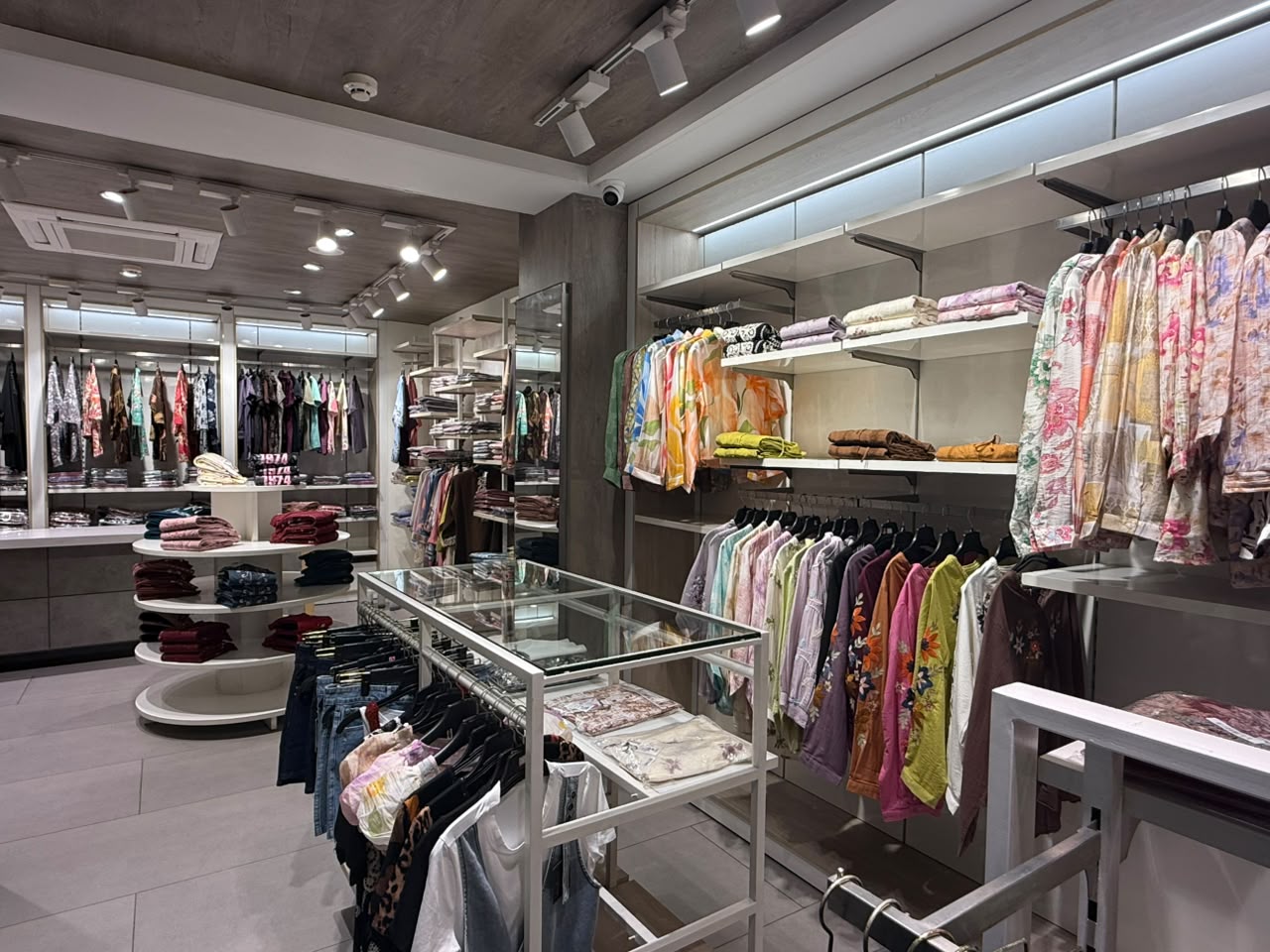 Floral printed shirts on display rack at Sahni Emporium Mohali